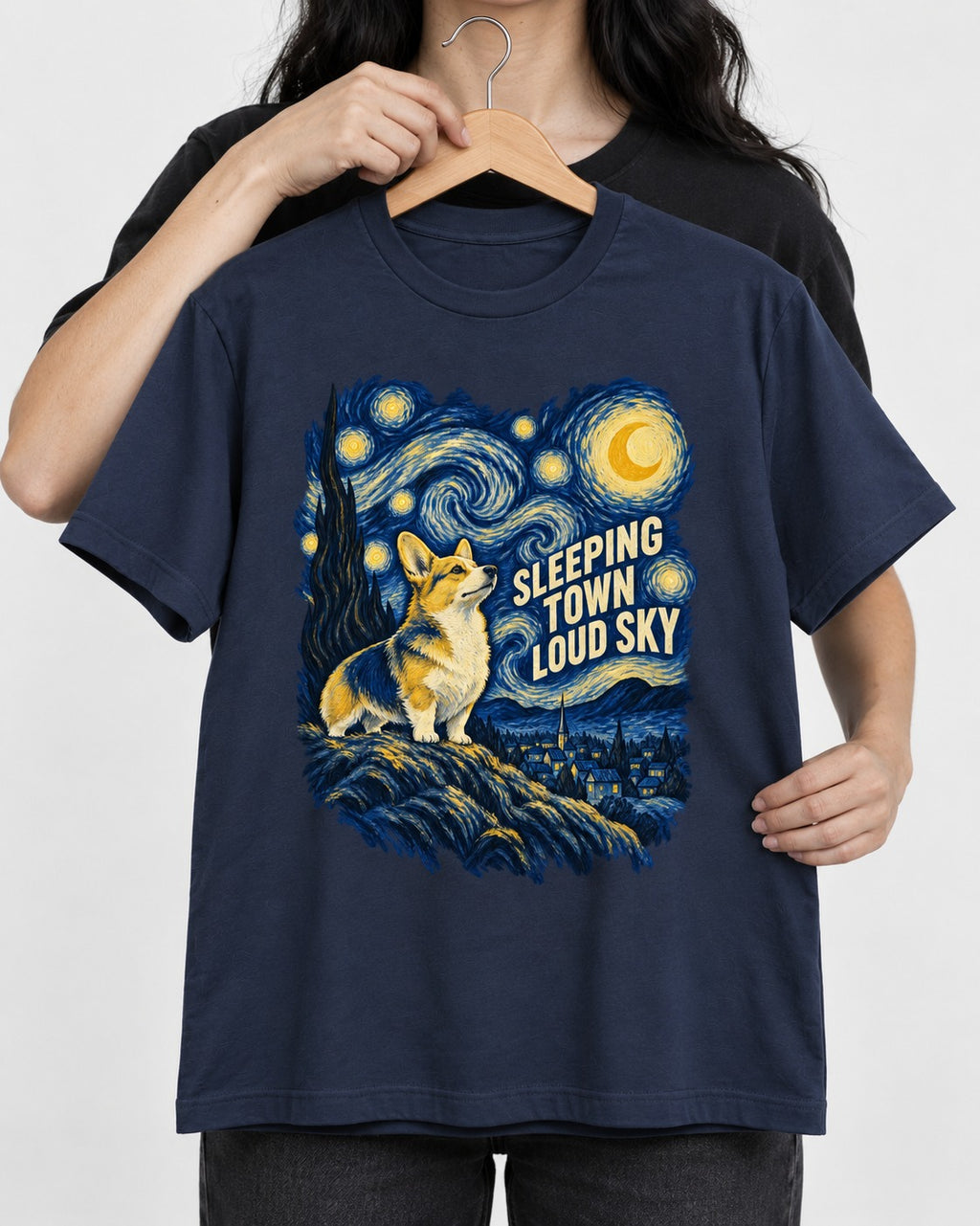 Corgi Sleeping Town Loud Sky Starry Night T-Shirt in Navy, held up on a hanger