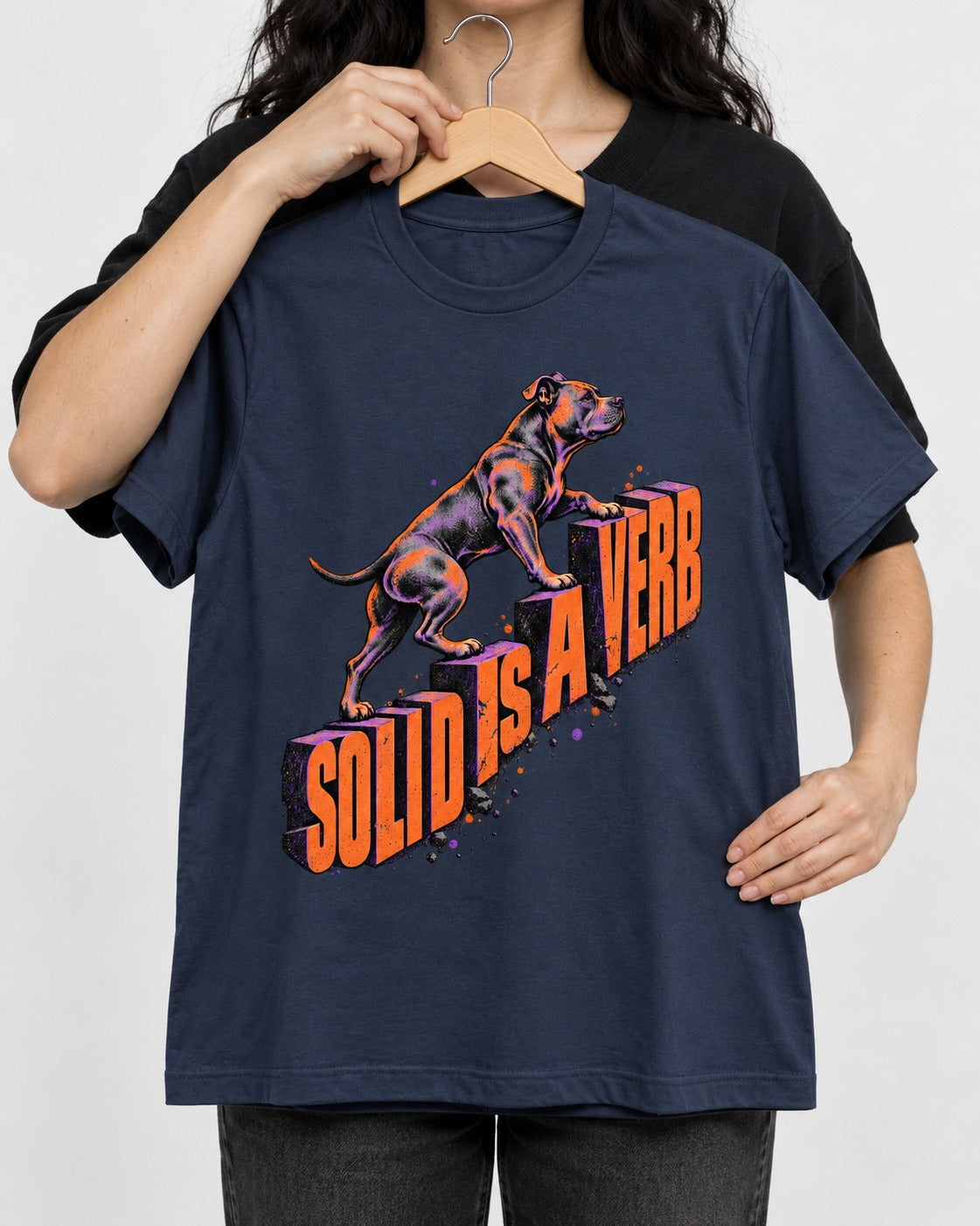Pitbull Solid Is a Verb Step Type Graphic T-Shirt in Navy, held up on a hanger