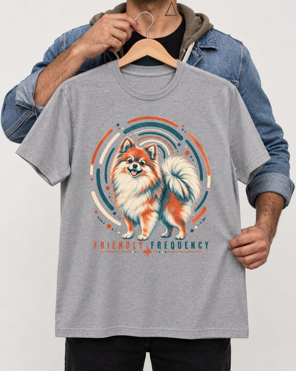 Friendly Frequency Pomeranian T-Shirt in Sport Grey, held up on a hanger