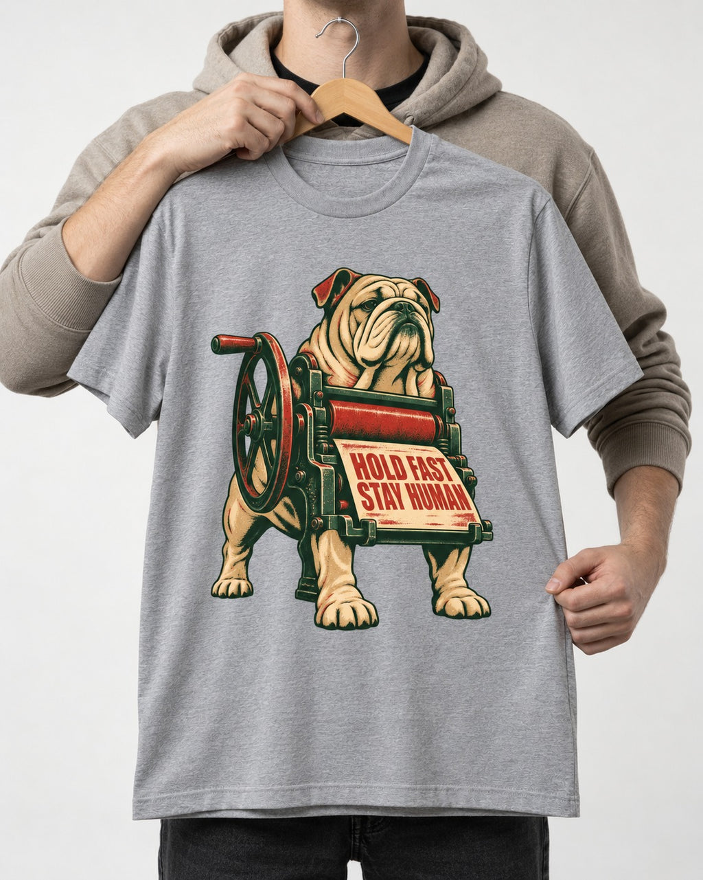 Hold Fast Stay Human English Bulldog T-Shirt in Sport Grey, held up on a hanger