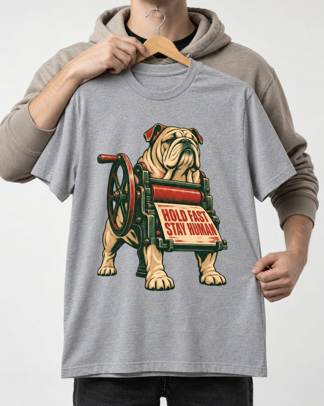 Hold Fast Stay Human English Bulldog T-Shirt in Sport Grey, held up on a hanger