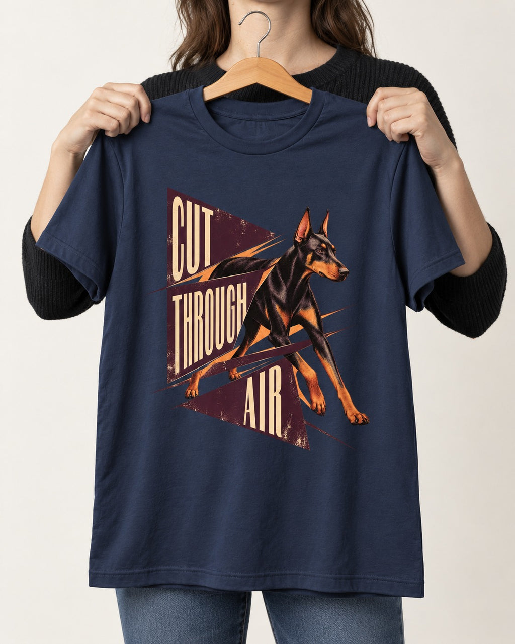 Doberman Cut Through Air Graphic T-Shirt in Navy, held up on a hanger
