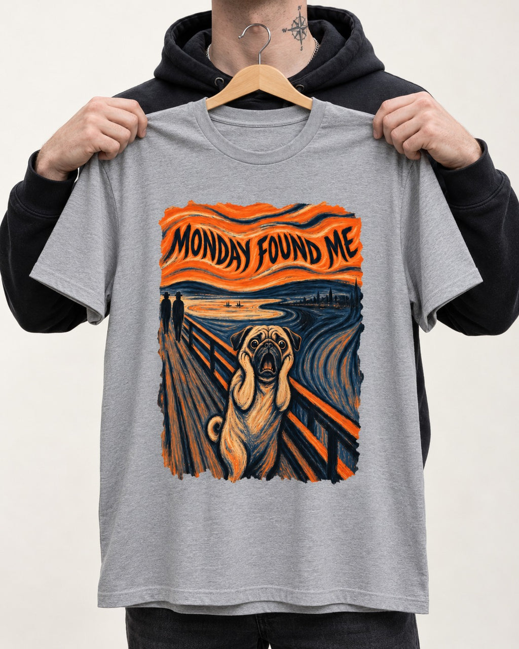 Pug Monday Found Me Scream Parody Graphic T-Shirt in Sport Grey, held up on a hanger
