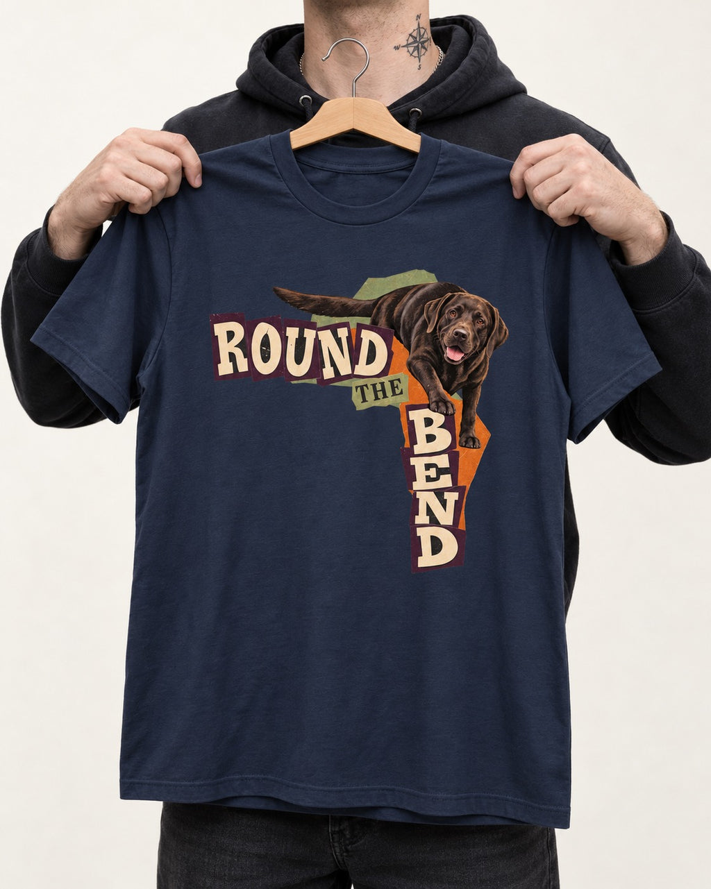 Labrador Retriever Round the Bend Collage Graphic T-Shirt in Navy, held up on a hanger