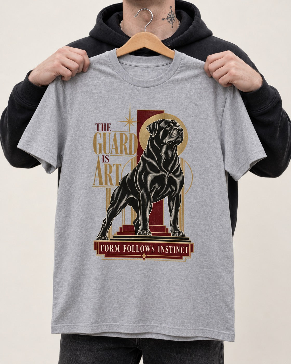 Rottweiler Form Follows Instinct T-Shirt in Sport Grey, held up on a hanger