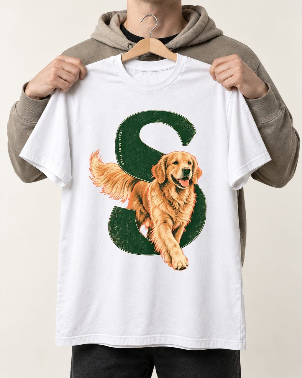 Golden Retriever Leave Some Space Monogram Graphic T-Shirt in White, held up on a hanger