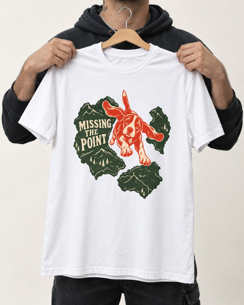 Missing The Point Beagle Trail T-Shirt in White, held up on a hanger