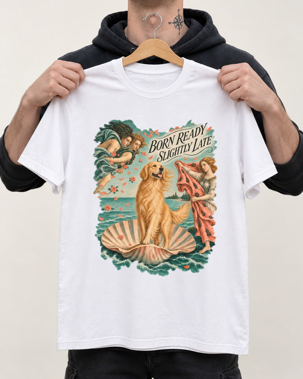 Born Ready Slightly Late Venus Golden Retriever Graphic T-Shirt in White, held up on a hanger