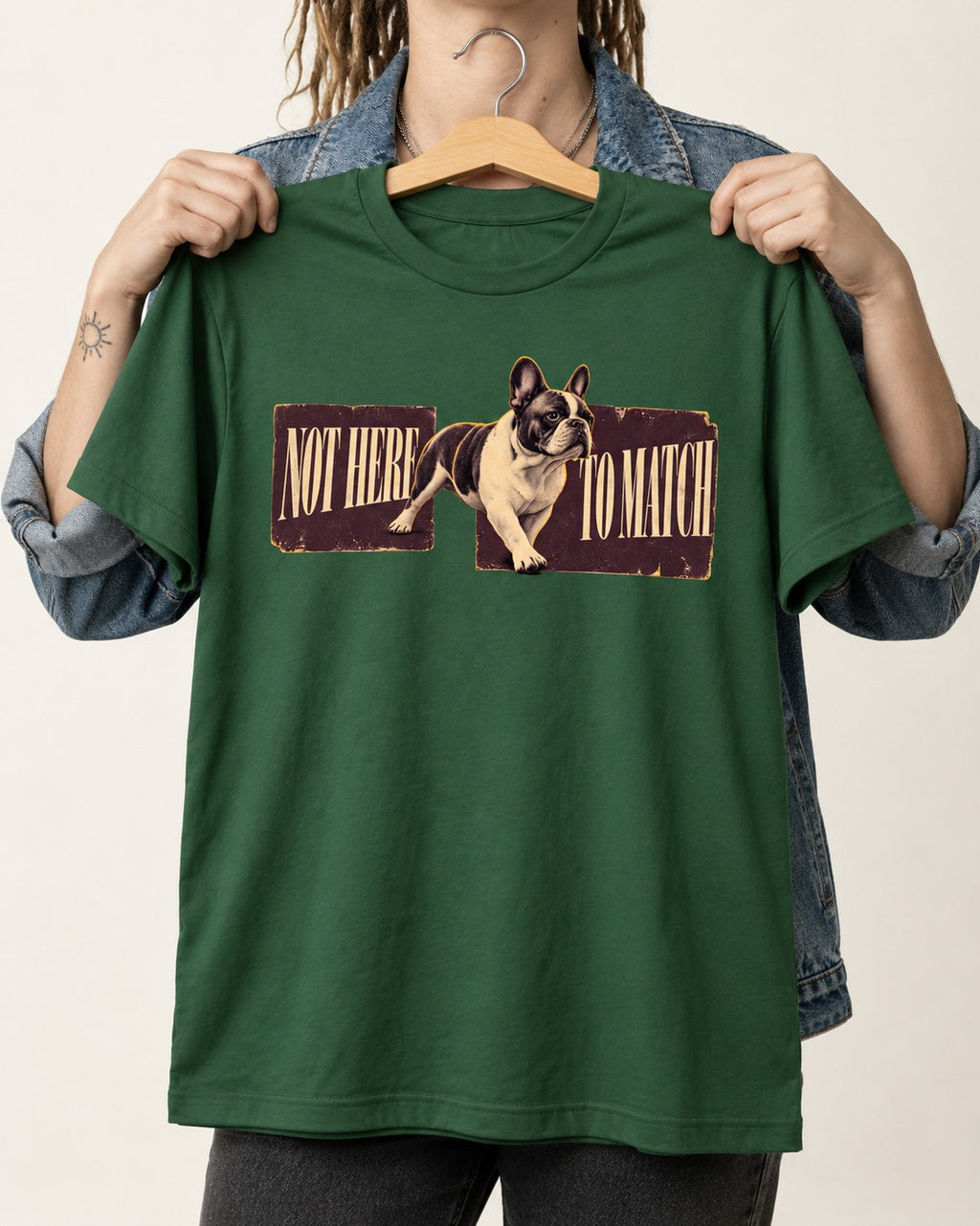 Frenchie Not Here to Watch Panels Graphic T-Shirt in Forest Green, held up on a hanger