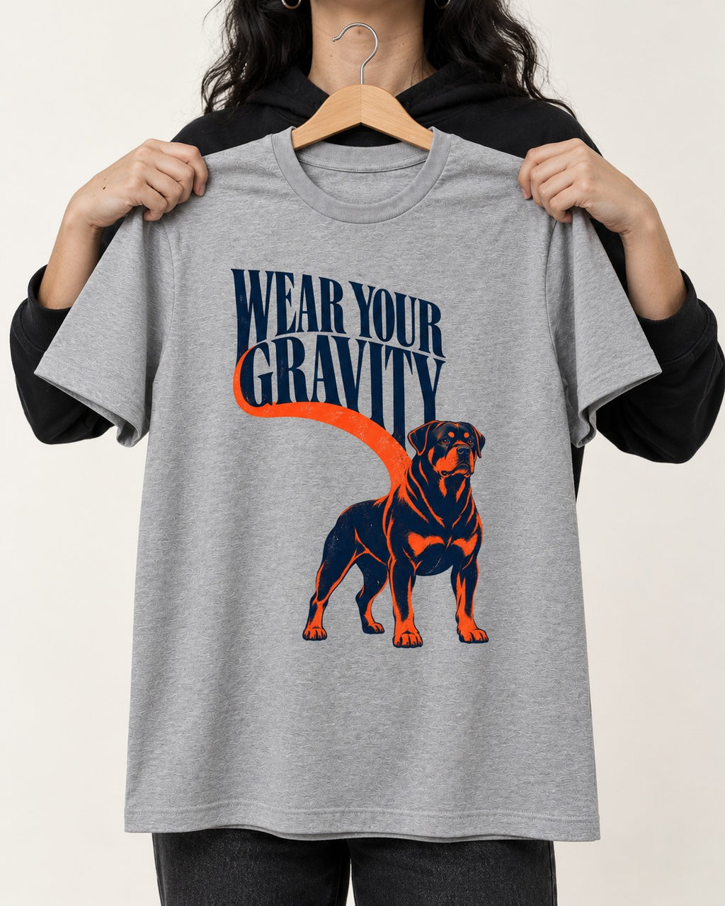Wear Your Gravity Rottweiler T-Shirt in Sport Grey, held up on a hanger