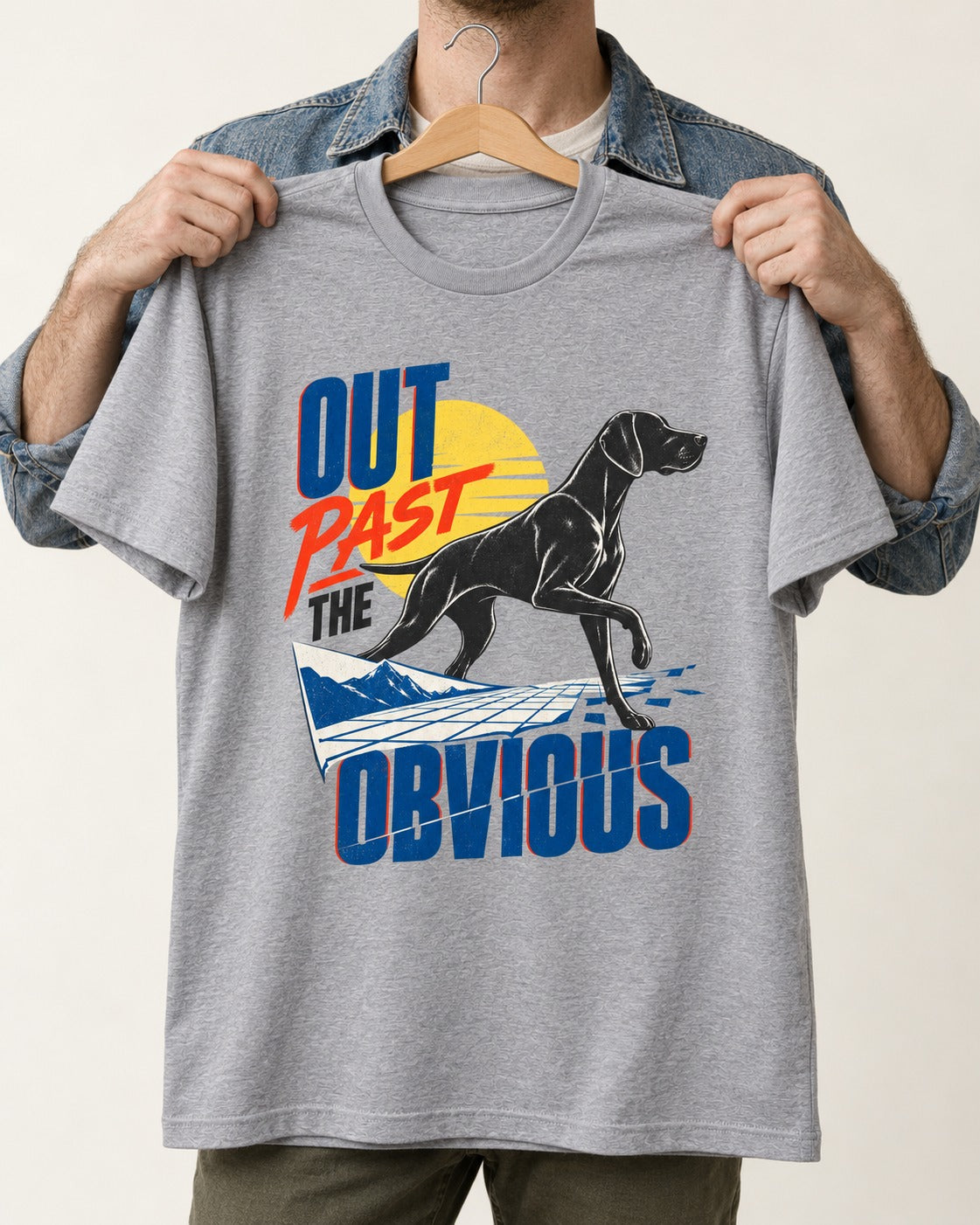 Out Past the Obvious German Shorthaired Pointer T-Shirt in Sport Grey, held up on a hanger