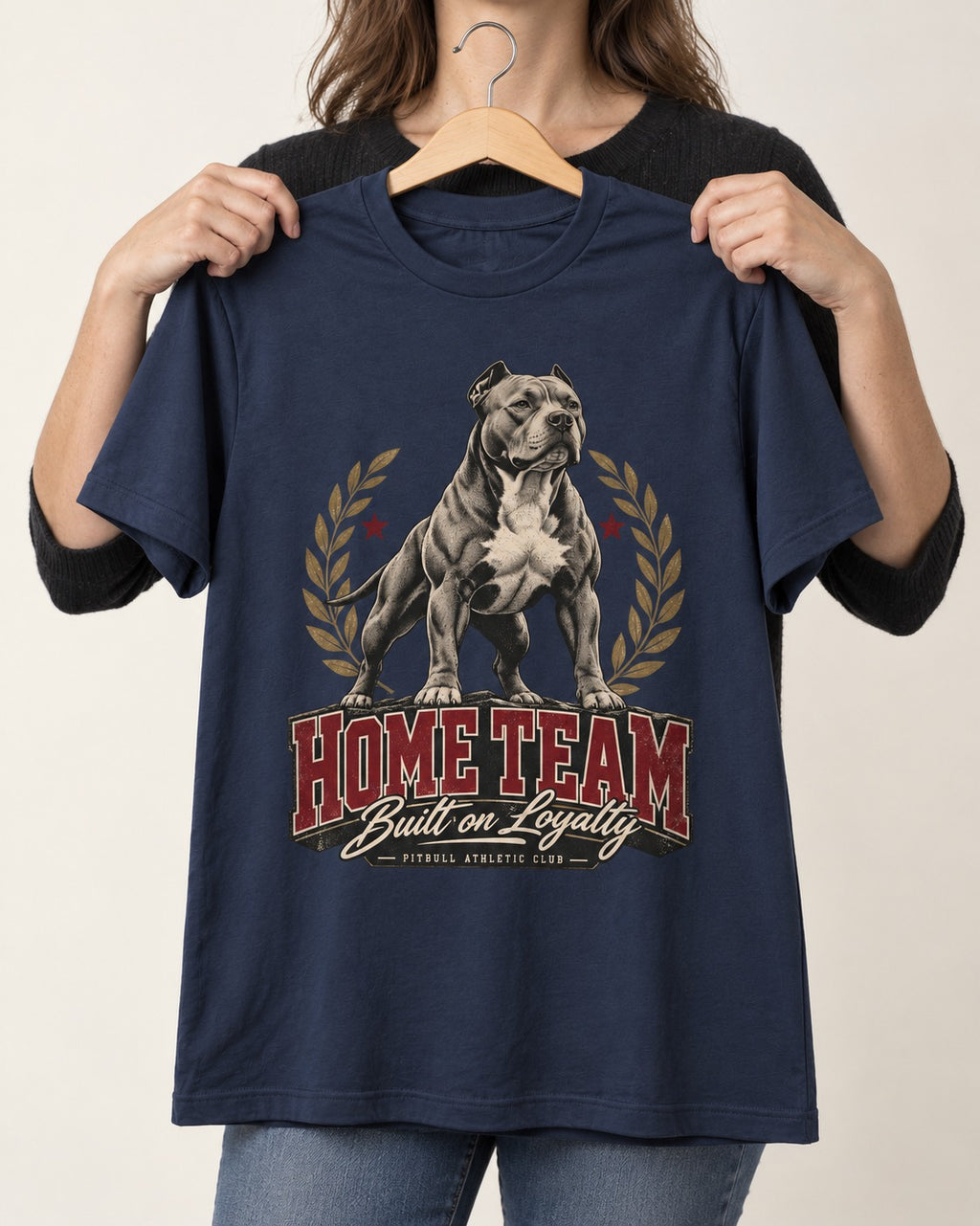 Pitbull Home Team Loyalty Crest Graphic T-Shirt in Navy, held up on a hanger