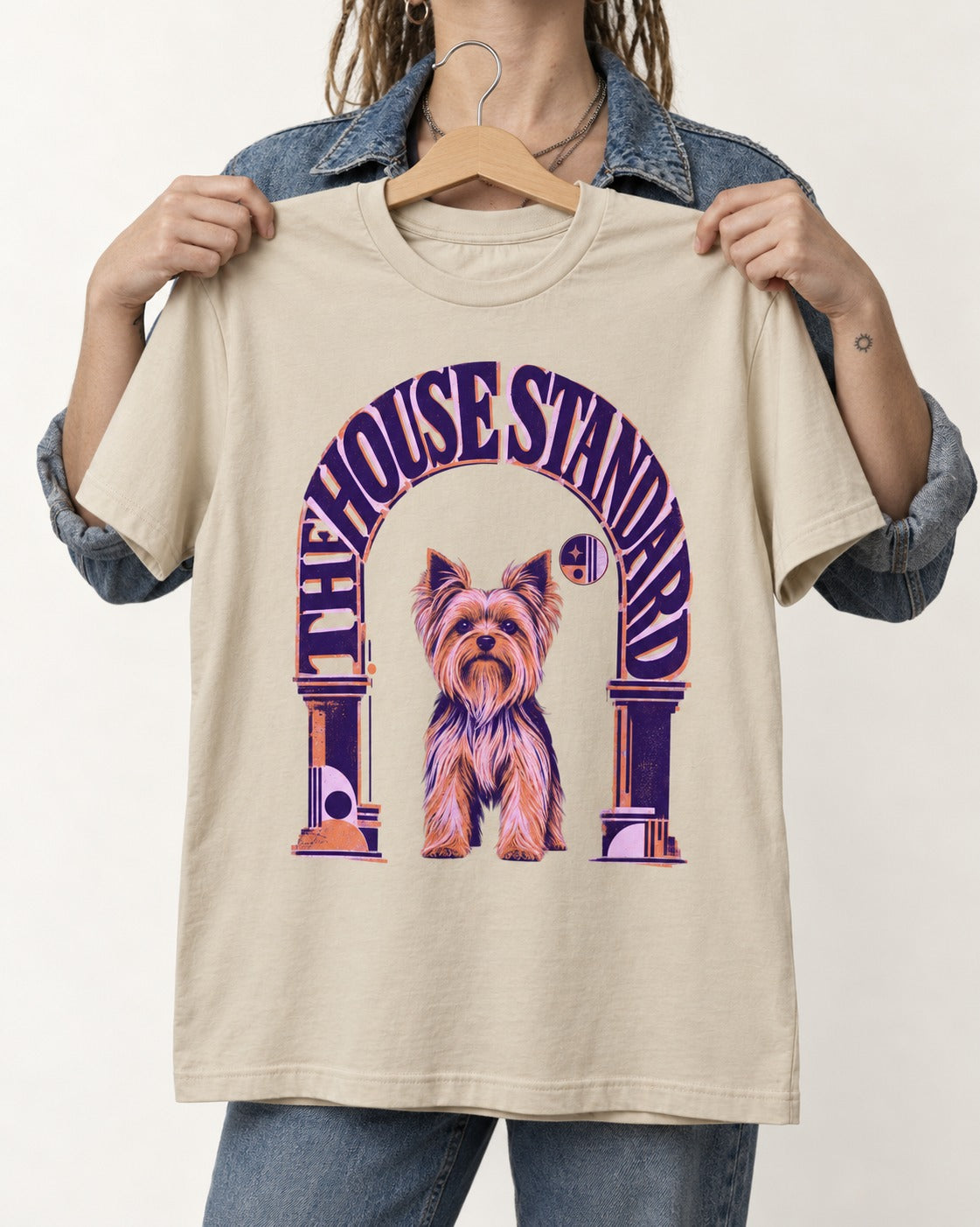 The Yorkshire Terrier House Standard T-Shirt in Sand, held up on a hanger