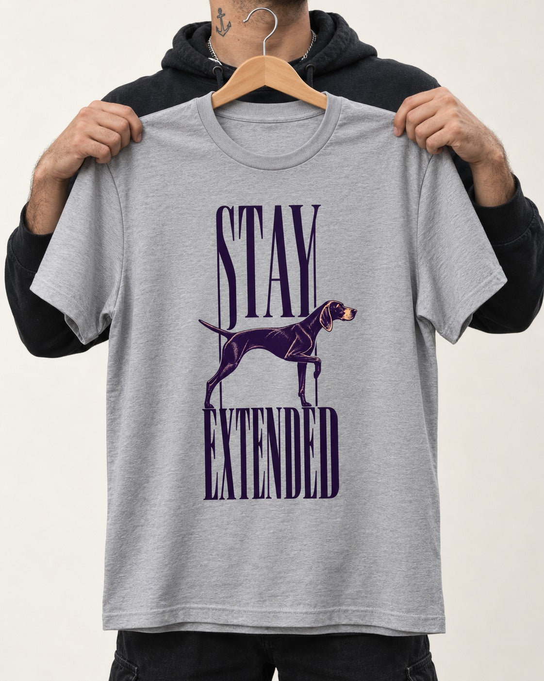 Stay Extended German Shorthaired Pointer T-Shirt in Sport Grey, held up on a hanger