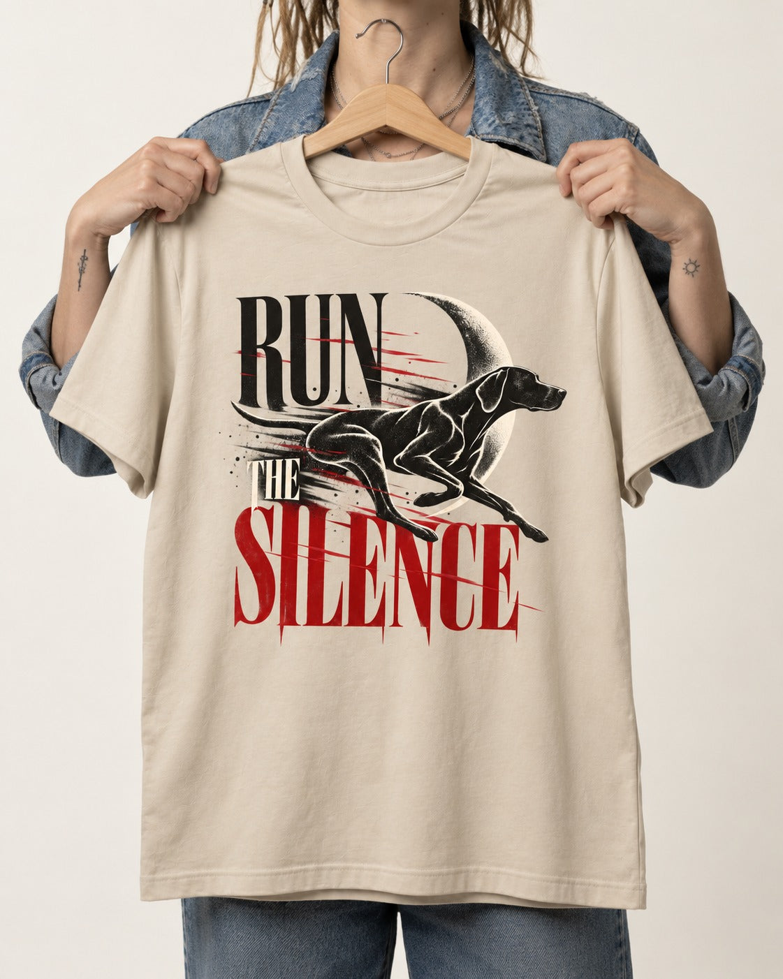 Run the Silence German Shorthaired Pointer T-Shirt in Sand, held up on a hanger