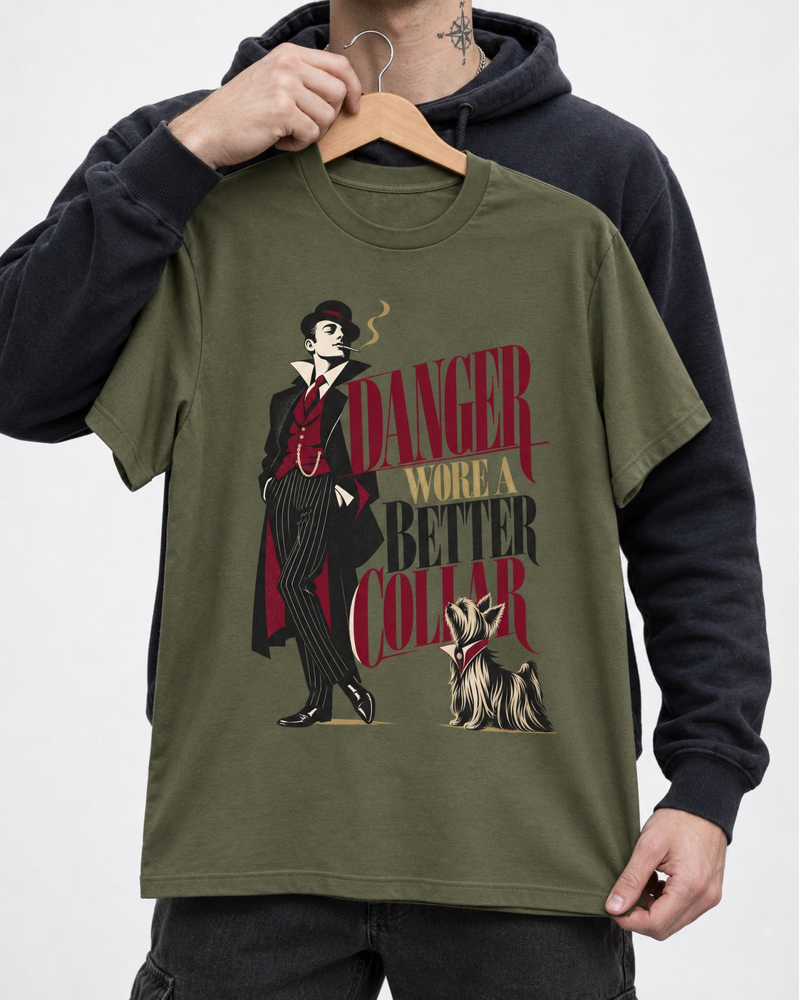 Yorkshire Terrier Danger Wore a Better Collar Art Deco Graphic T-Shirt in Heather Military Green, held up on a hanger