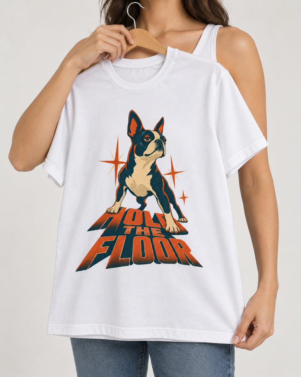 Boston Terrier On The Floor Perspective Graphic T-Shirt in White, held up on a hanger