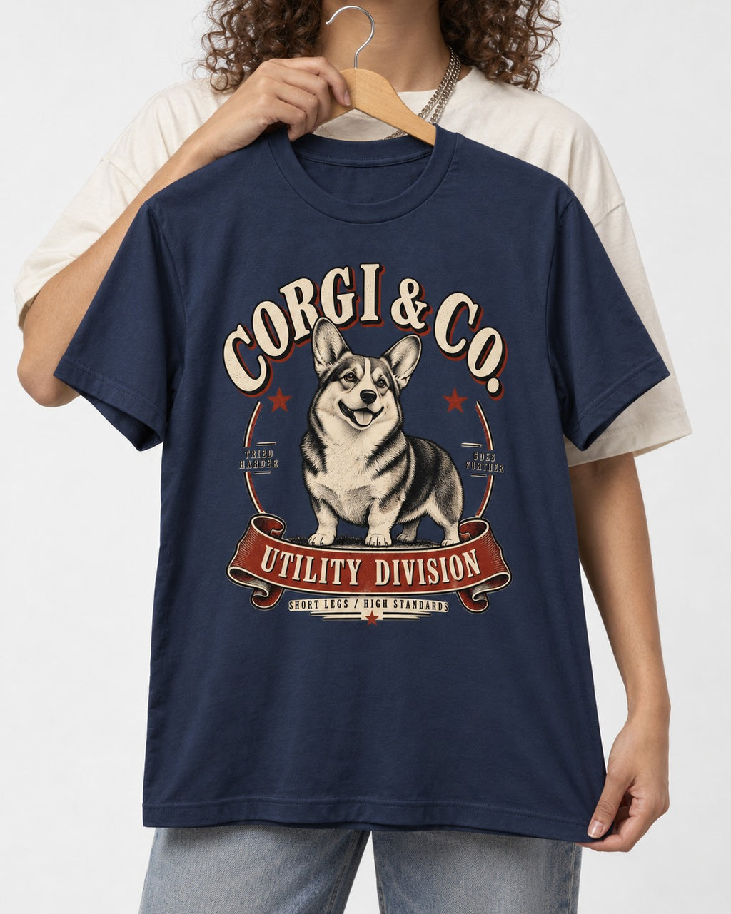 Corgi's High Standards T-Shirt in Navy, held up on a hanger