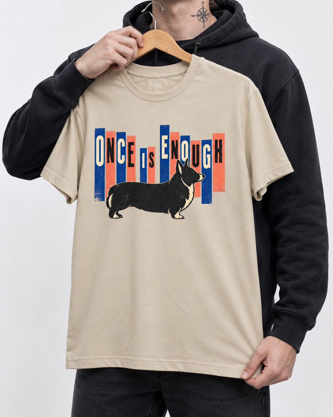 Corgi Once Is Enough T-Shirt in Sand, held up on a hanger