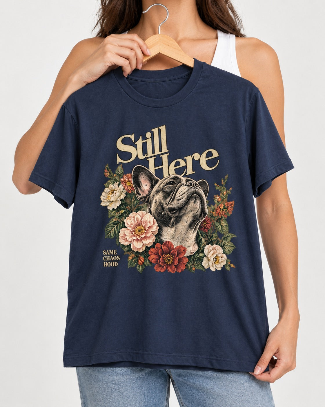 Frenchie Still Here Floral Portrait Graphic T-Shirt in Navy, held up on a hanger