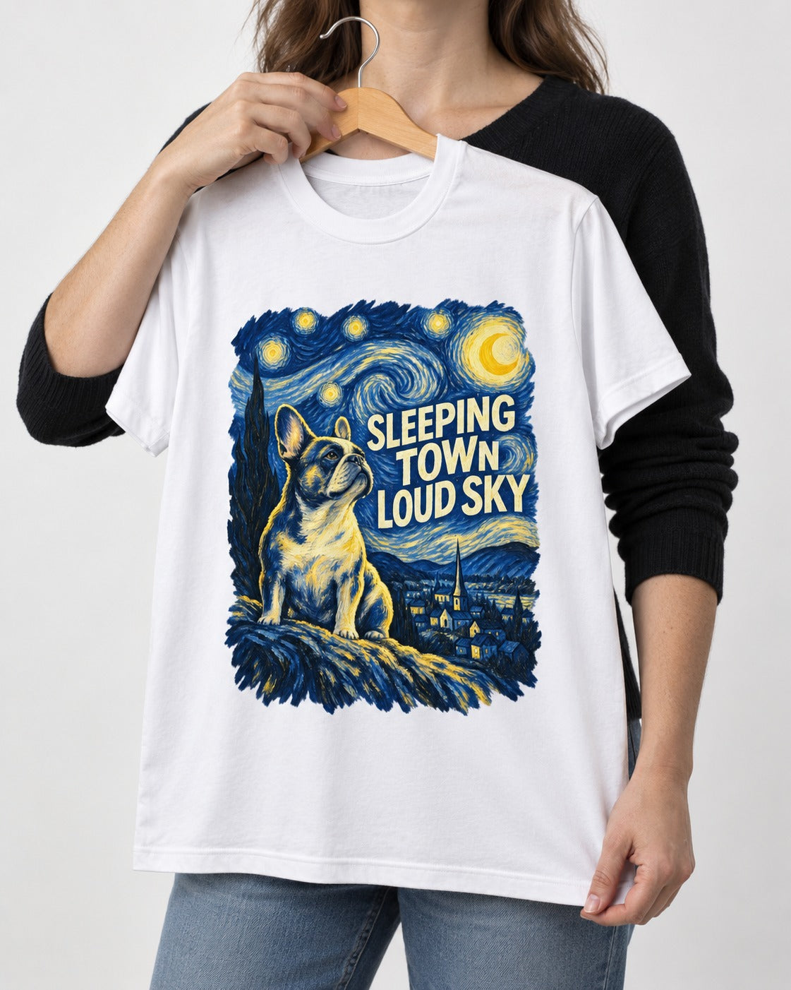 Frenchie Sleeping Town Loud Sky Graphic T-Shirt in White, held up on a hanger