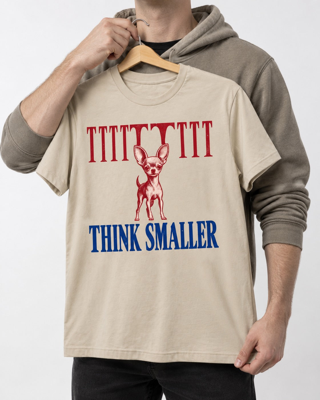 Think Smaller Chihuahua T-Shirt in Sand, held up on a hanger