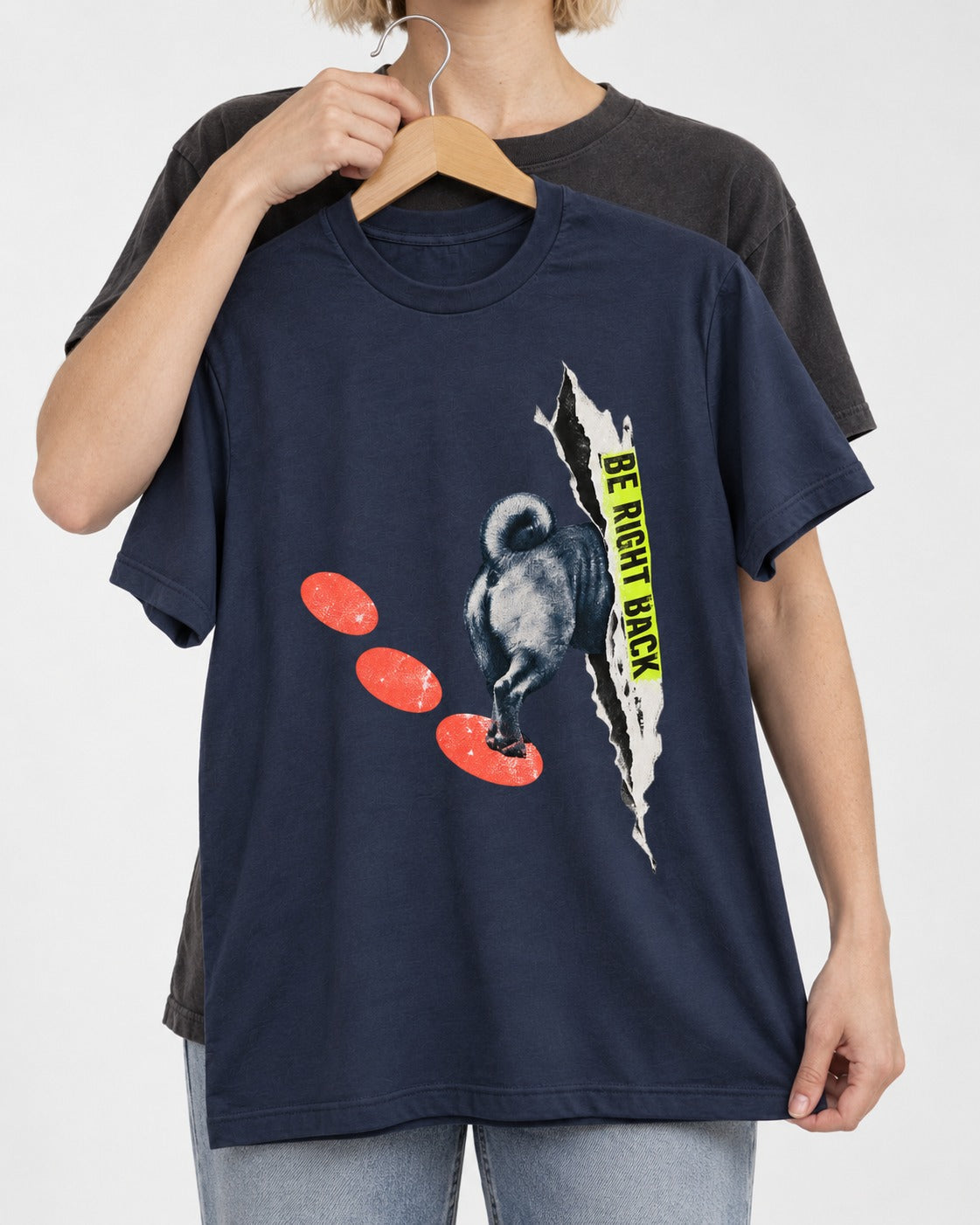 Pug Be Right Back Torn Portal Graphic T-Shirt in Navy, held up on a hanger