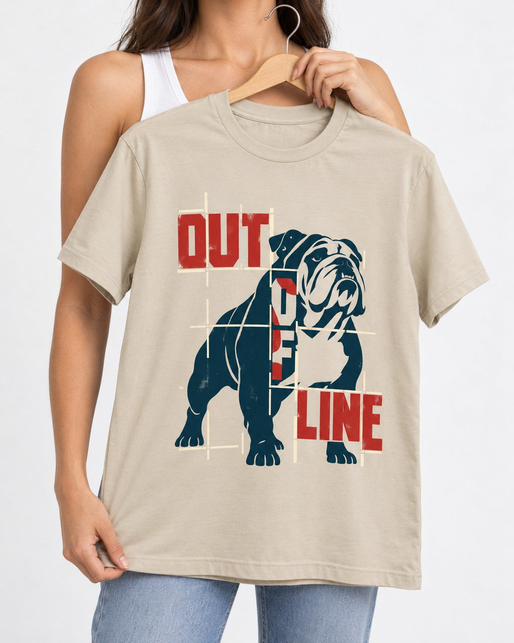 English Bulldog Out of Line T-Shirt in Sand, held up on a hanger