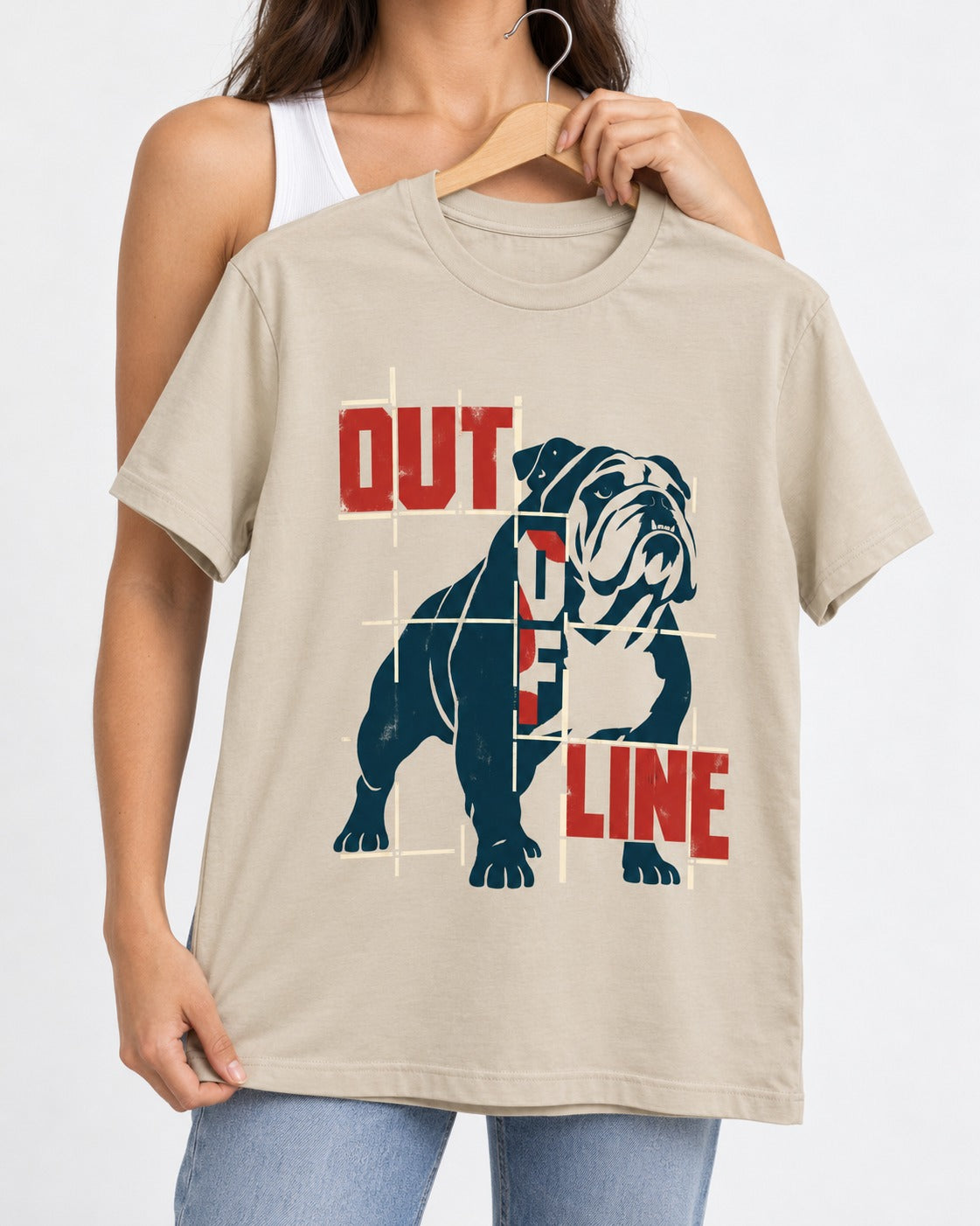 English Bulldog Out of Line T-Shirt in Sand, held up on a hanger
