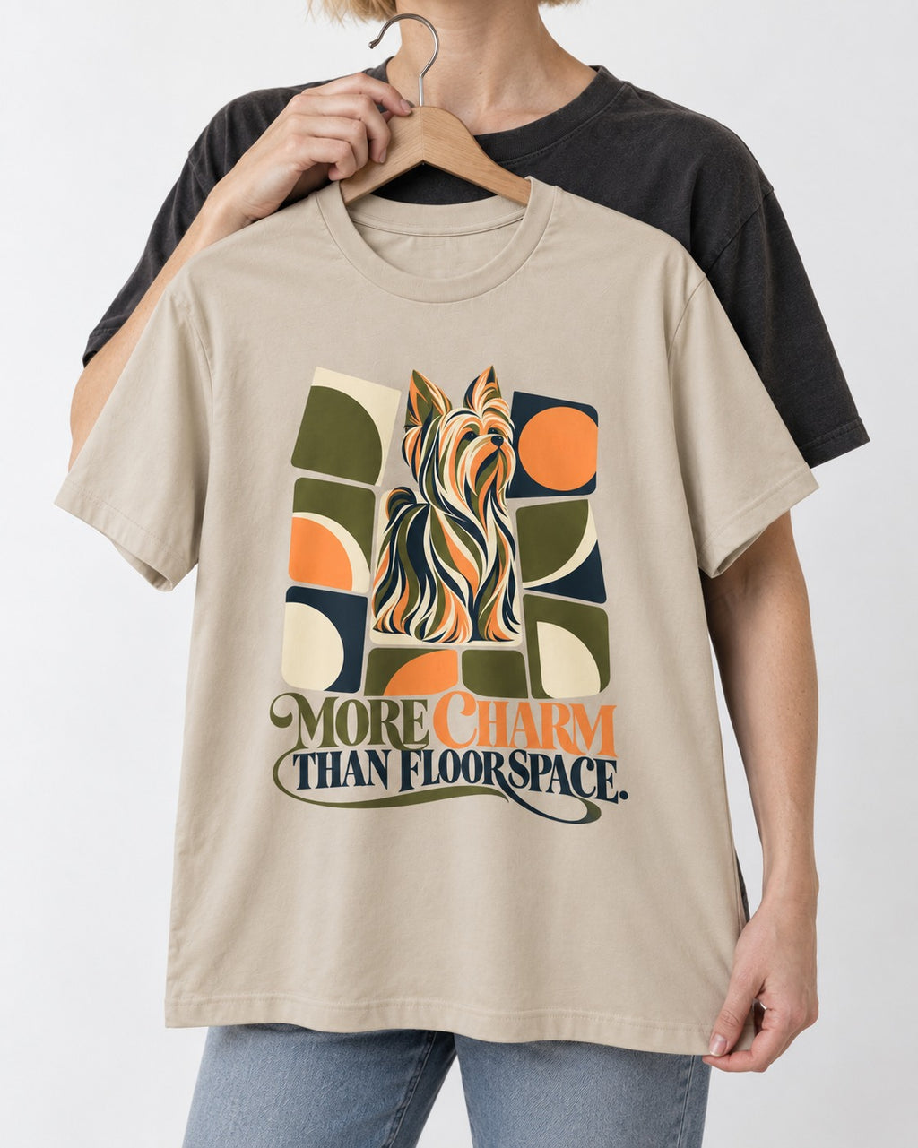 Yorkshire Terrier More Charm Than Space T-Shirt in Sand, held up on a hanger