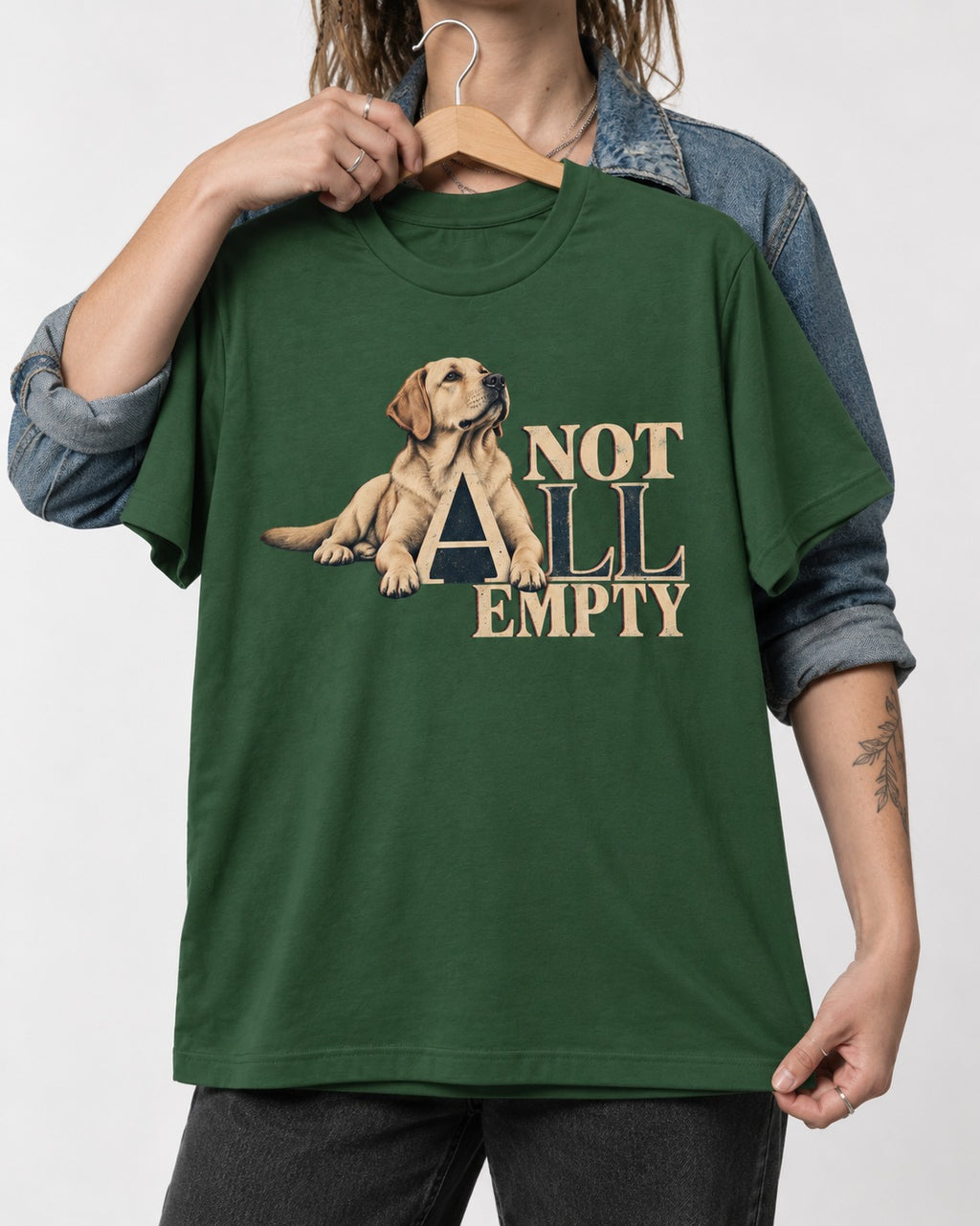 Labrador Retriever Not All Empty Lounging Typography Graphic T-Shirt in Forest Green, held up on a hanger