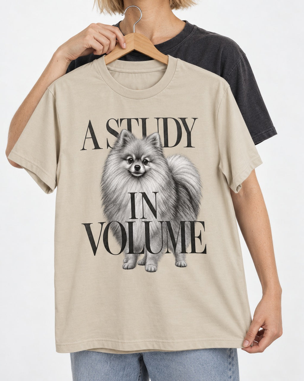 Pomeranian Study in Volume T-Shirt in Sand, held up on a hanger