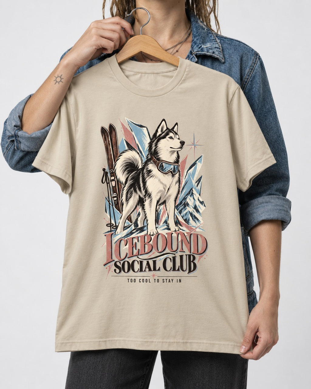 Icebound Husky T-Shirt in Sand, held up on a hanger