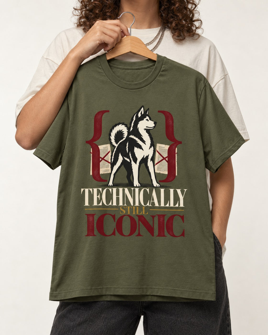 Husky Technically Still Iconic Editorial Frame Graphic T-Shirt in Heather Military Green, held up on a hanger