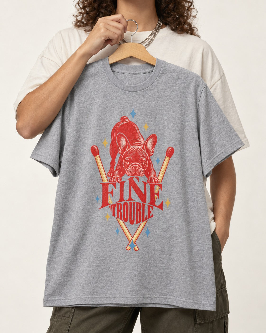 Fine Trouble Boston Terrier Matchstick Graphic T-Shirt in Sport Grey, held up on a hanger