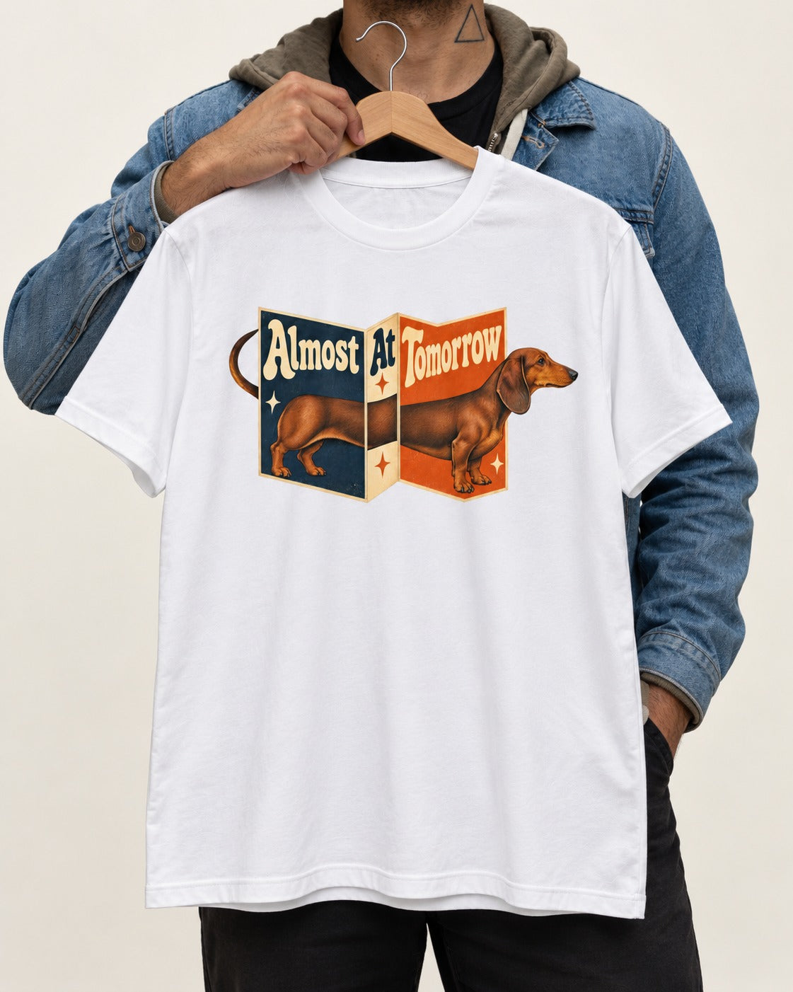 Dachshund Almost At Tomorrow Folding Screen Graphic T-Shirt in White, held up on a hanger