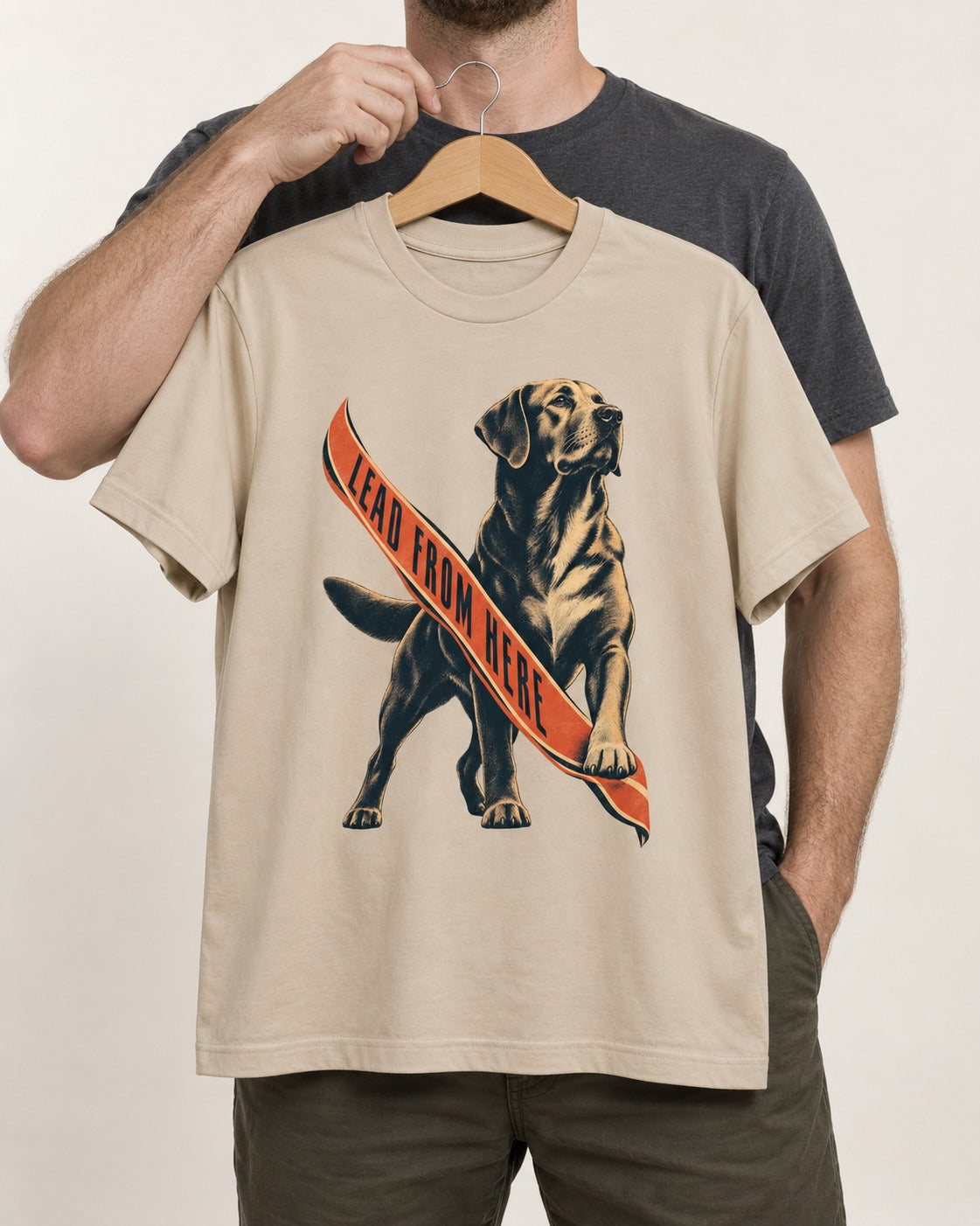 Lead From Here Labrador Retriever T-Shirt in Sand, held up on a hanger