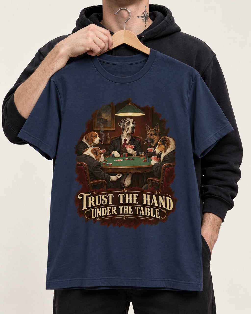 Great Dane Trust the Hand Under the Table Poker Graphic T-Shirt in Navy, held up on a hanger