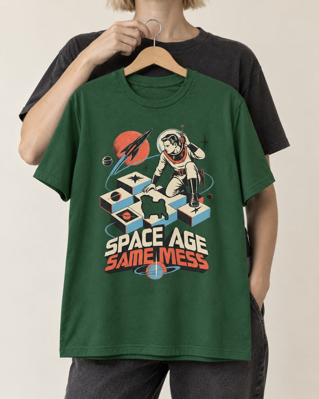 Pug Space Age Same Mess Astronaut Graphic T-Shirt in Forest Green, held up on a hanger