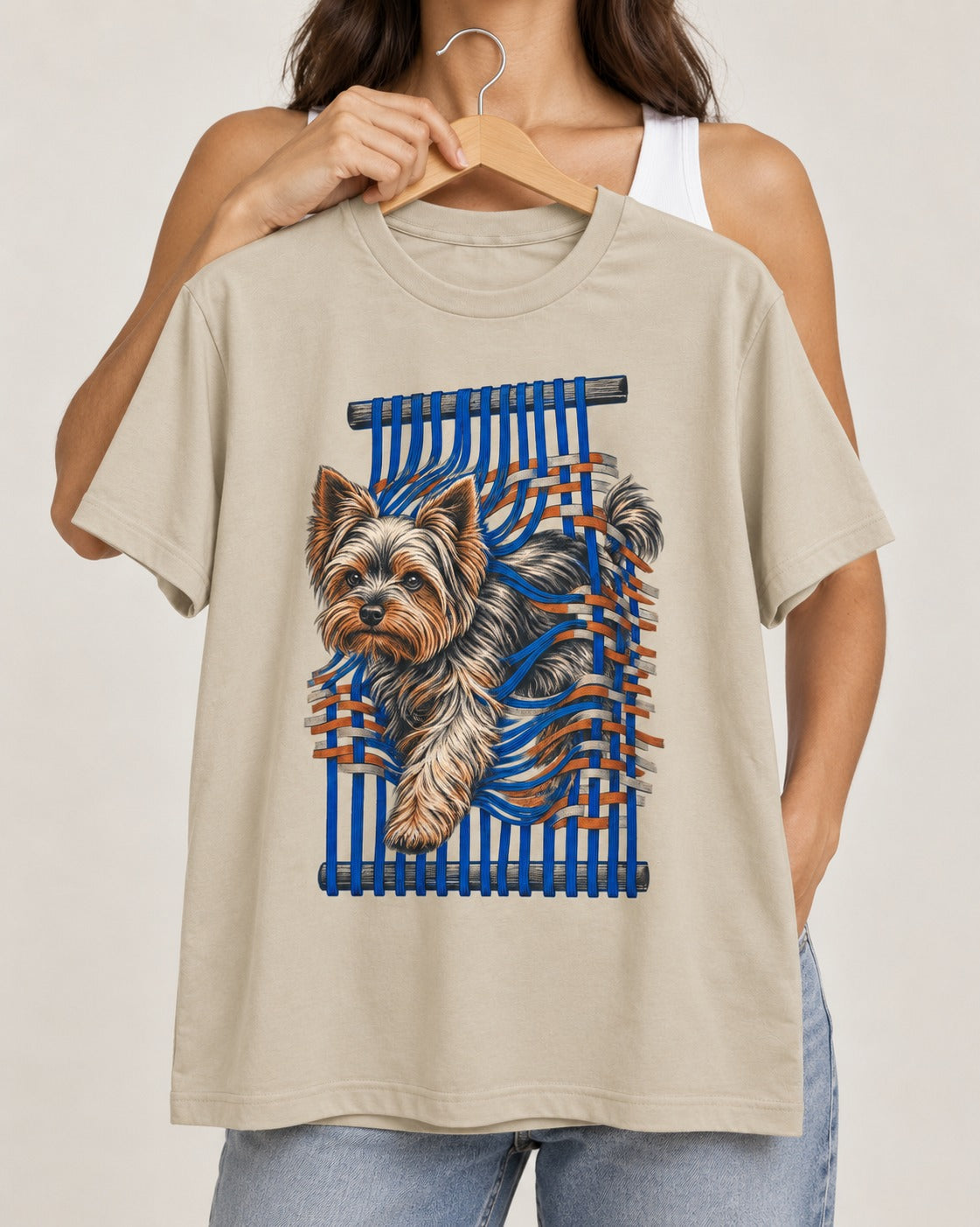 Yorkshire Terrier Unbound T-Shirt in Sand, held up on a hanger