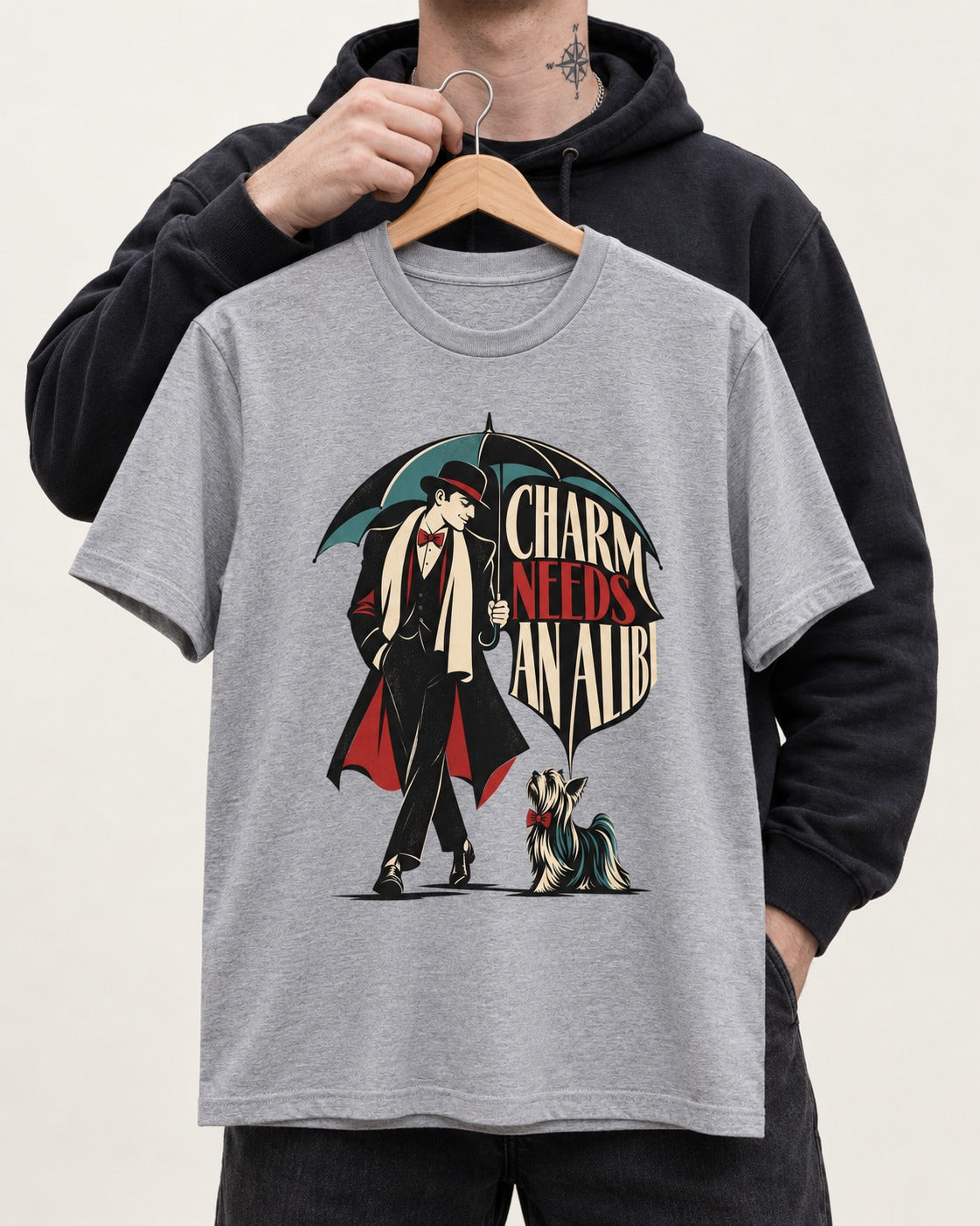 Charm Needs an Alibi Yorkshire Terrier T-Shirt in Sport Grey, held up on a hanger