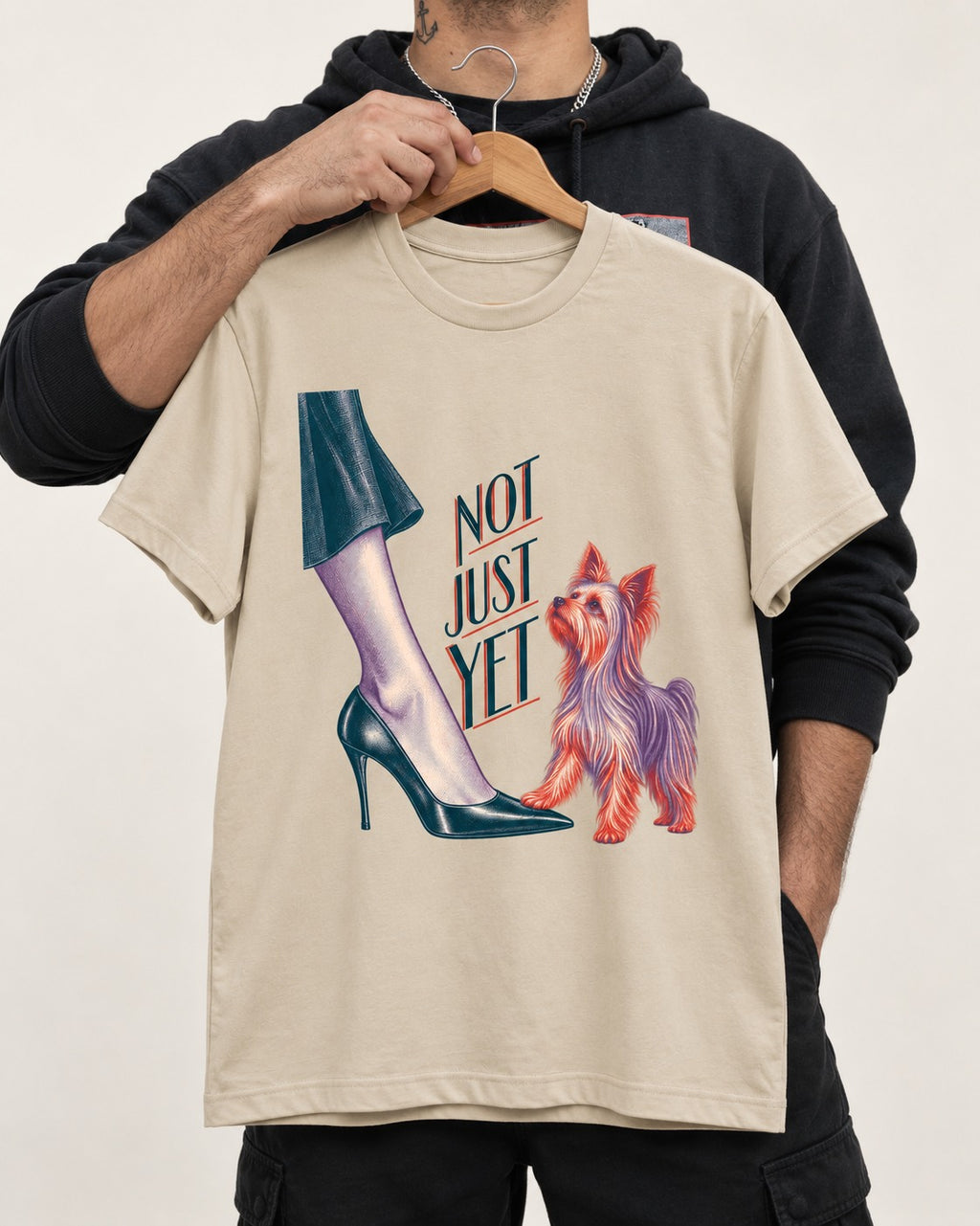 Not Just Yet Yorkshire Terrier T-Shirt in Sand, held up on a hanger
