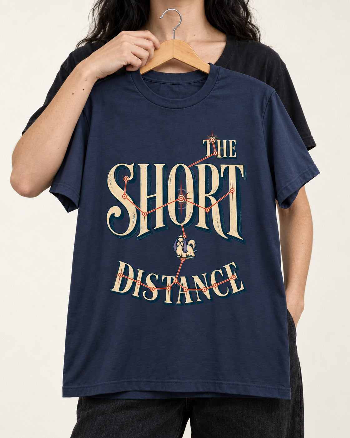 Shih Tzu The Short Distance Route Graphic T-Shirt in Navy, held up on a hanger