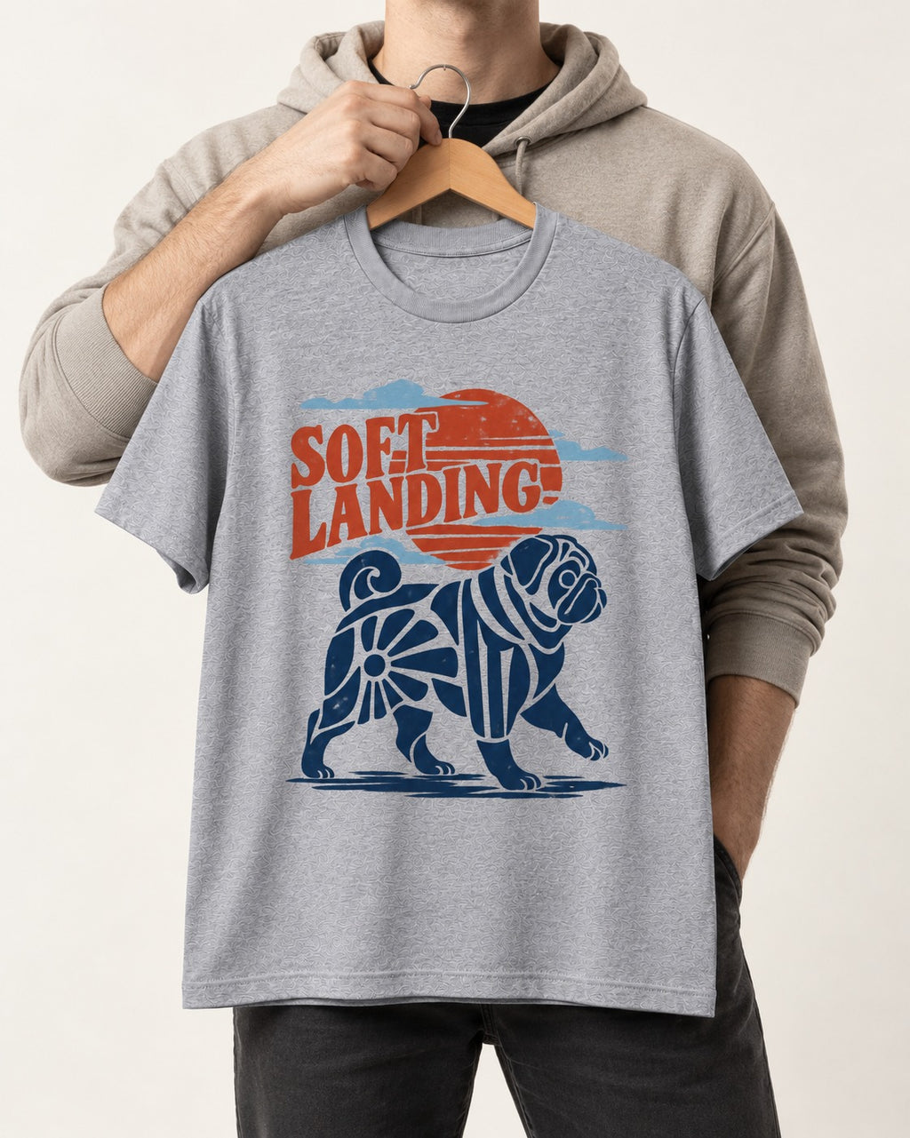 Pug's Soft Landing T-Shirt in Sport Grey, held up on a hanger
