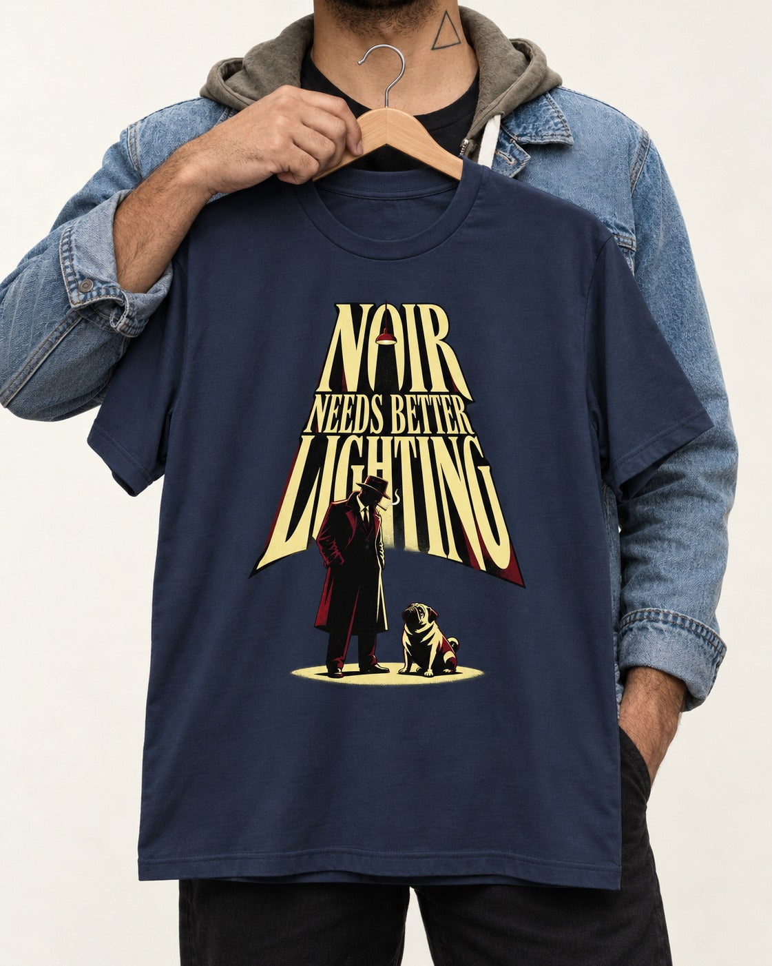 Pug Noir Needs Better Lighting Detective Graphic T-Shirt in Navy, held up on a hanger