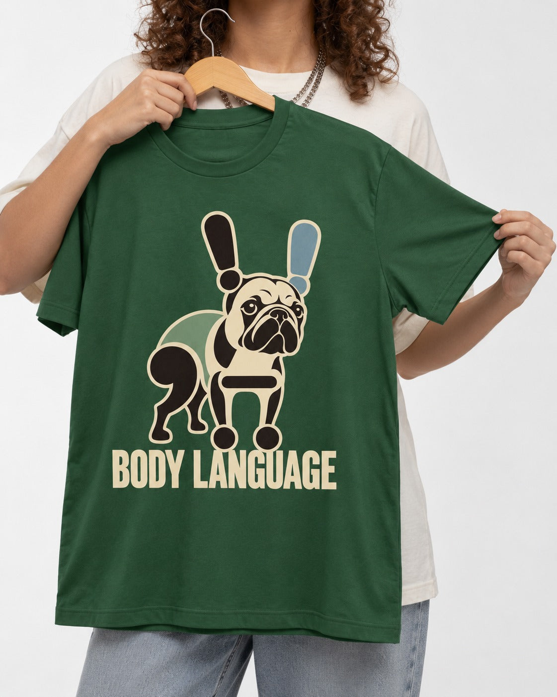 Frenchie Body Language Punctuation Graphic T-Shirt in Forest Green, held up on a hanger