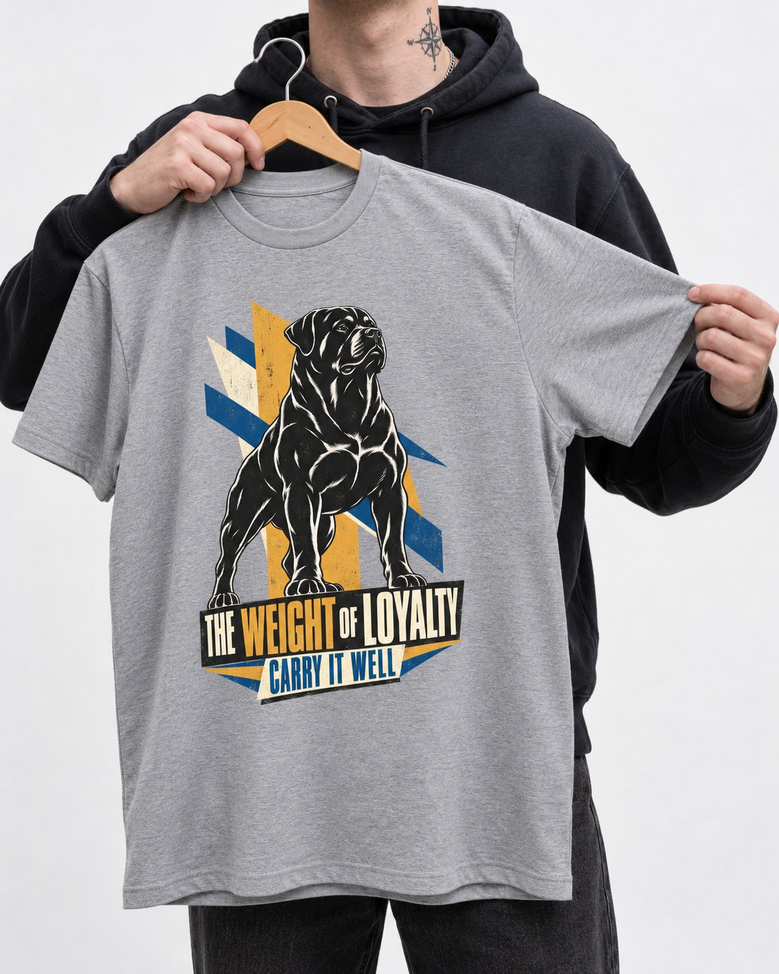 Rottweiler Weight of Loyalty T-Shirt in Sport Grey, held up on a hanger