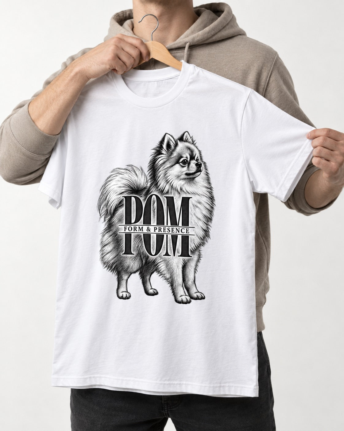 Pomeranian Form and Presence Monogram Graphic T-Shirt in White, held up on a hanger