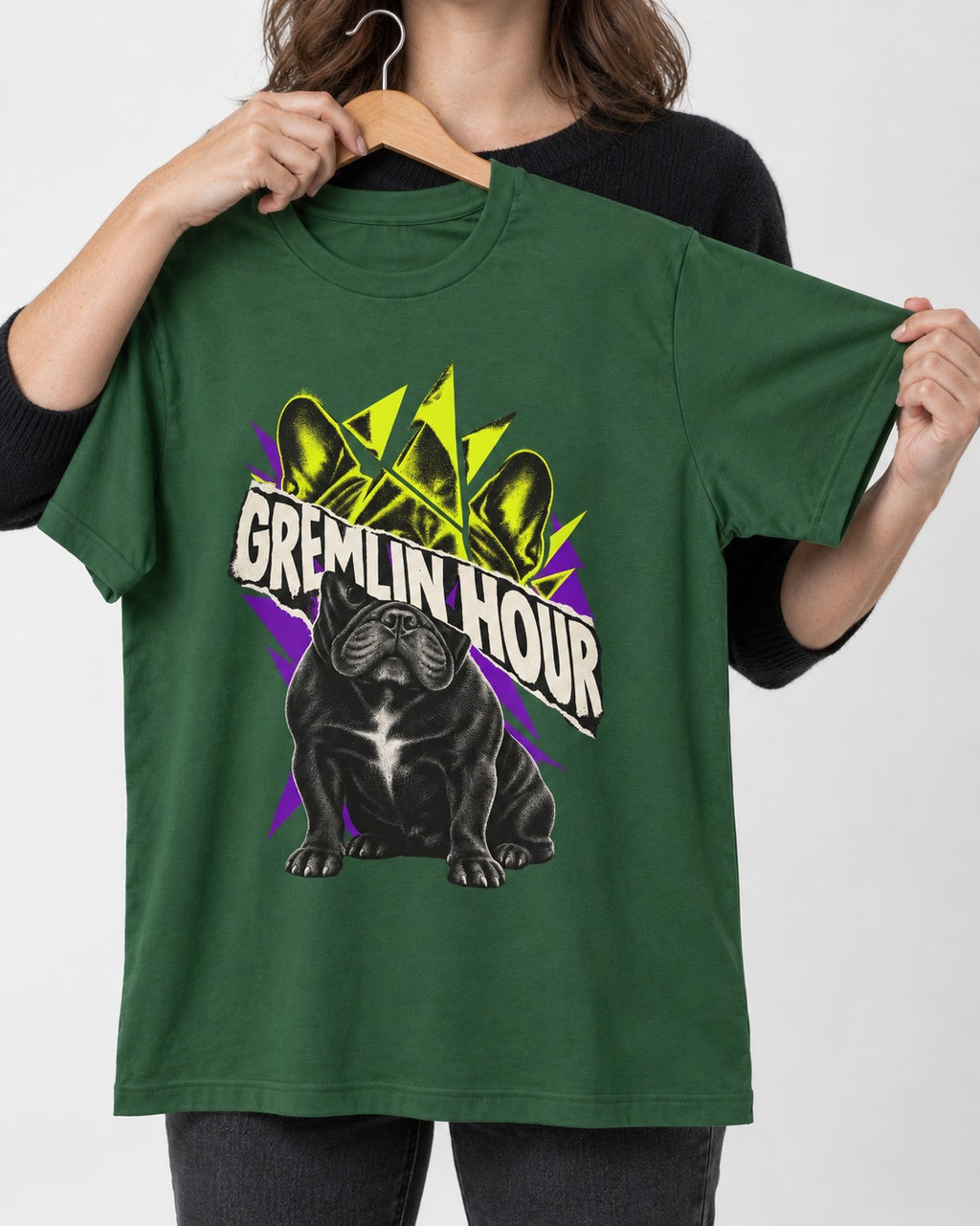 Frenchie Gremlin Hour Fracture Portrait Graphic T-Shirt in Forest Green, held up on a hanger
