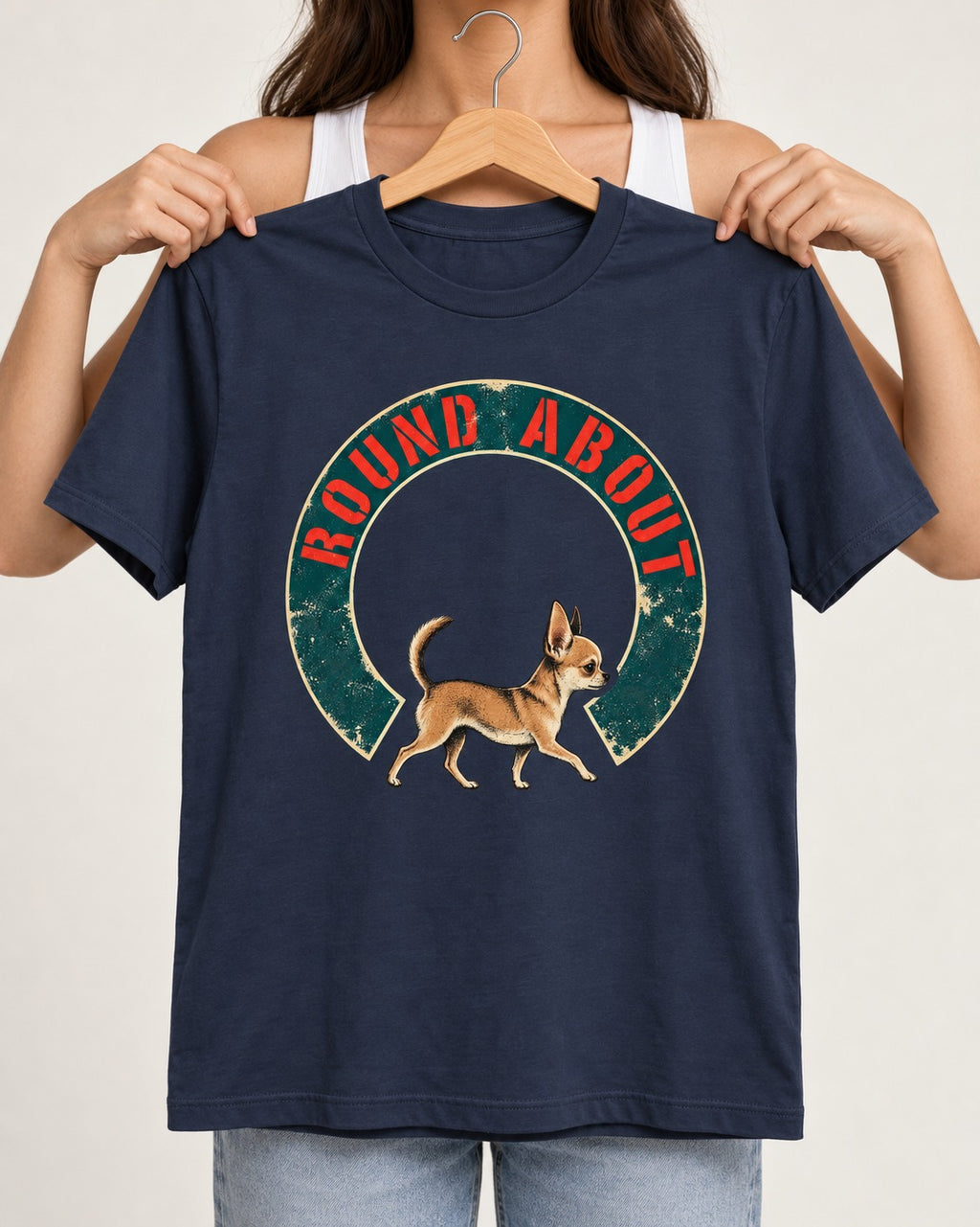 Round About Chihuahua Emblem Graphic T-Shirt in Navy, held up on a hanger